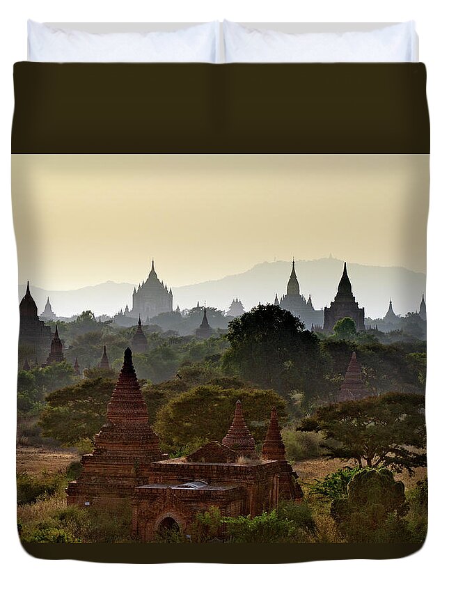 Tranquility Duvet Cover featuring the photograph Temples In Distant Haze At Sunset by Rwp Uk