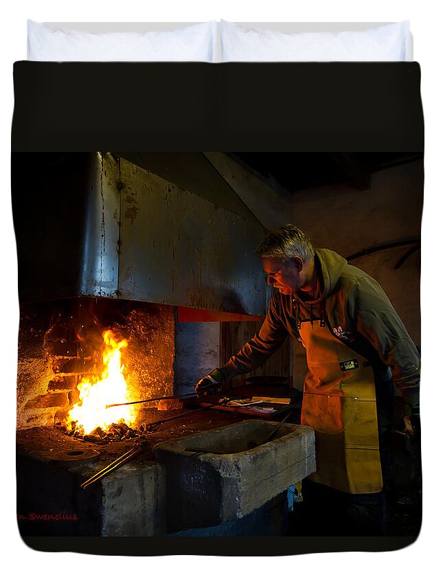 The Torresta Blacksmith Duvet Cover featuring the photograph The Torresta Blacksmith by Torbjorn Swenelius