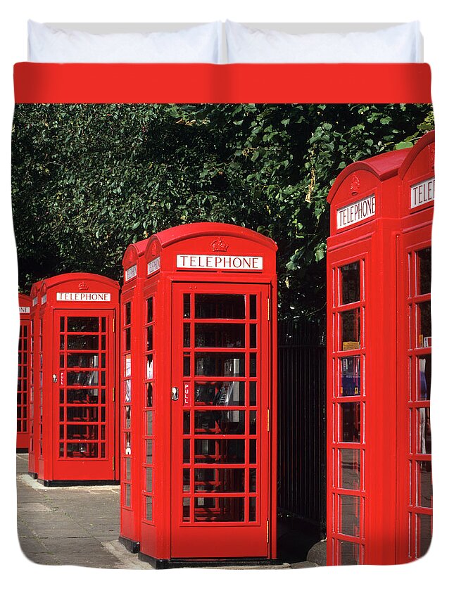 In A Row Duvet Cover featuring the photograph Traditional Red Telephone Boxes In by Hisham Ibrahim