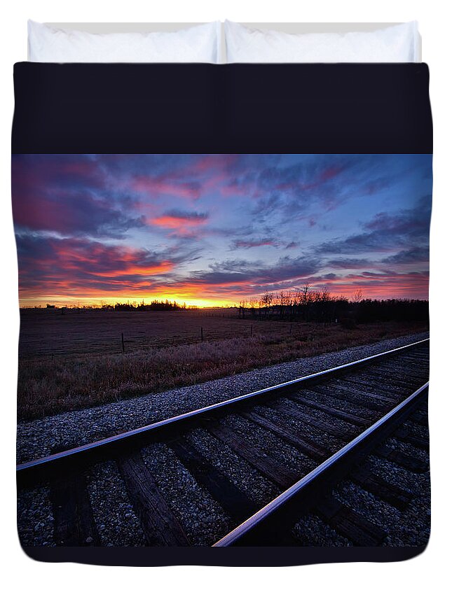 Rail Transportation Duvet Cover featuring the photograph Train Tracks And A Dramatic Colourful by John Kroetch / Design Pics