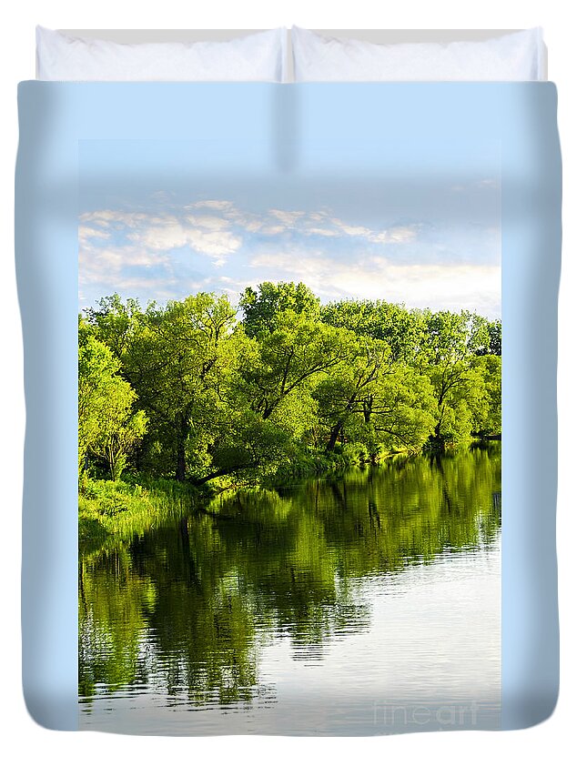 Trees Duvet Cover featuring the photograph Trees reflecting in river by Elena Elisseeva