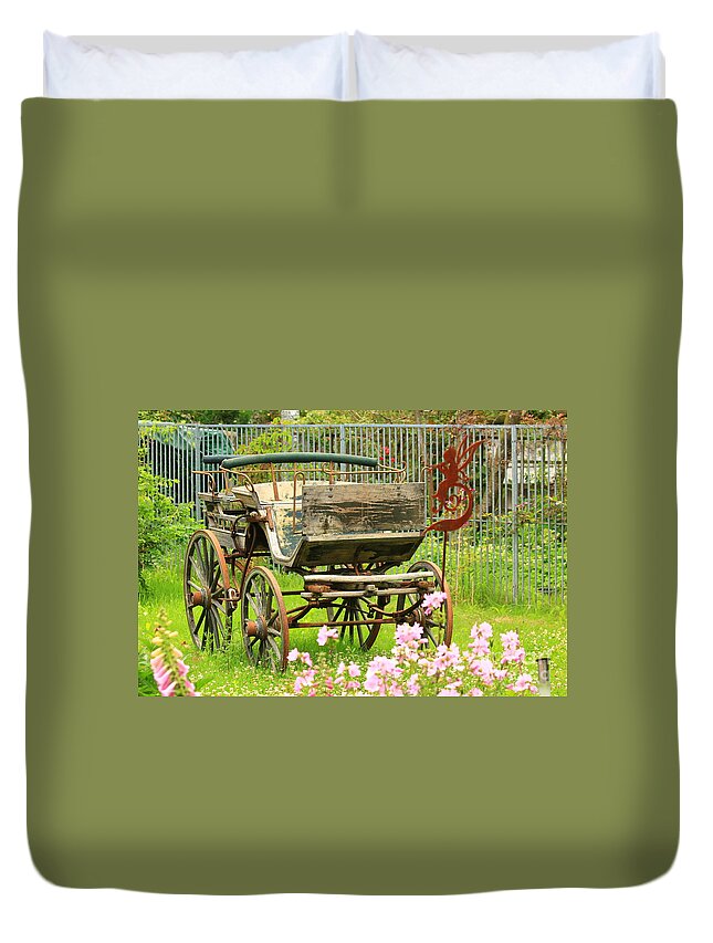 Aged Duvet Cover featuring the photograph Vintage horse carriage in a flower bed by Amanda Mohler