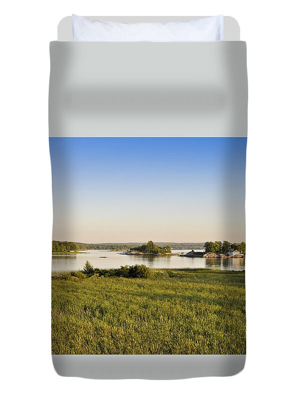 White Duvet Cover featuring the photograph White cottage on rocky island by Les Palenik