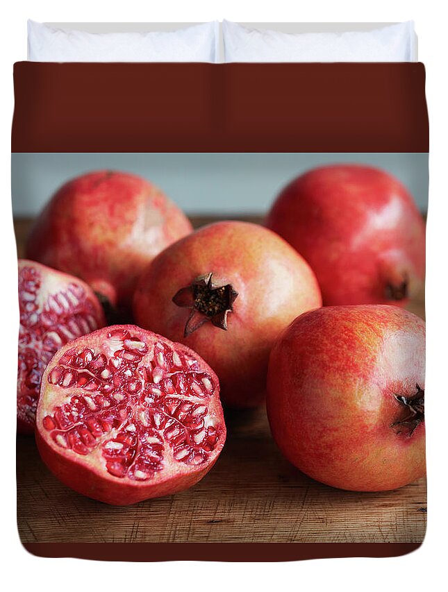 Cutting Board Duvet Cover featuring the photograph Whole And Halved Pomegranates by Danielle Wood