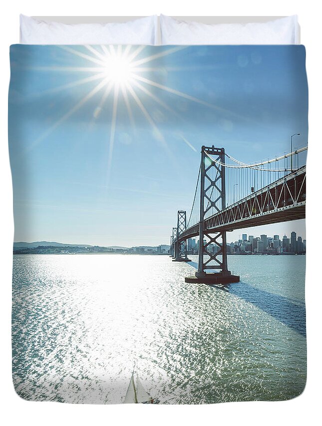Scenics Duvet Cover featuring the photograph Yacht Through Bay Bridge by Chinaface