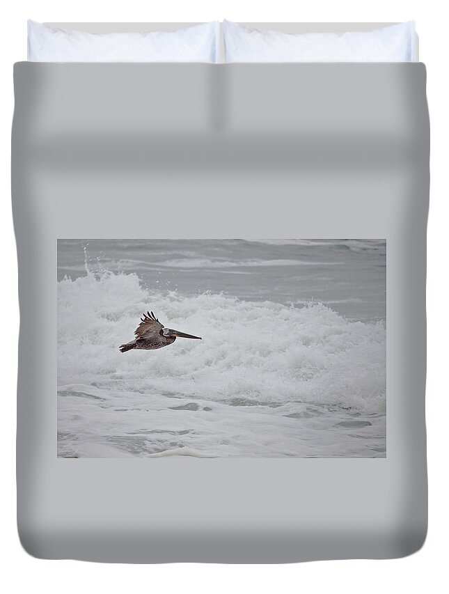 Pelican Duvet Cover featuring the photograph flying Pelican #2 by Ralf Kaiser