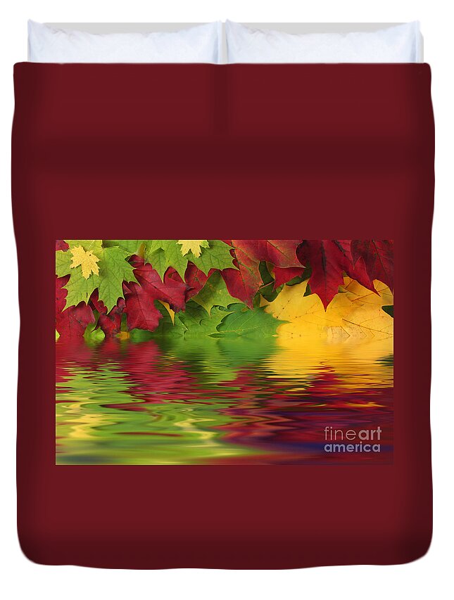 Leaves Duvet Cover featuring the photograph Autumn leaves in water with reflection by Simon Bratt