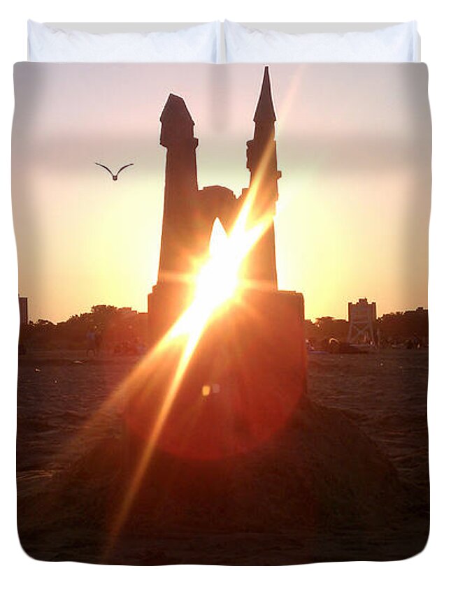 Sunset Duvet Cover featuring the photograph Sunset Sunlit Sandcastle with Flying Bird on a Chicago Beach by M Zimmerman