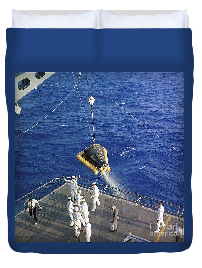 1965 Duvet Cover featuring the photograph The Gemini-3 Spacecraft Is Hoisted by Stocktrek Images