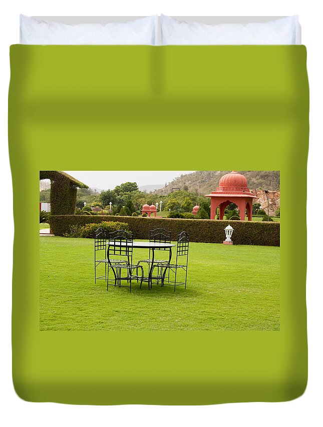India Duvet Cover featuring the photograph Wrought metal chairs around a table in a lawn by Ashish Agarwal