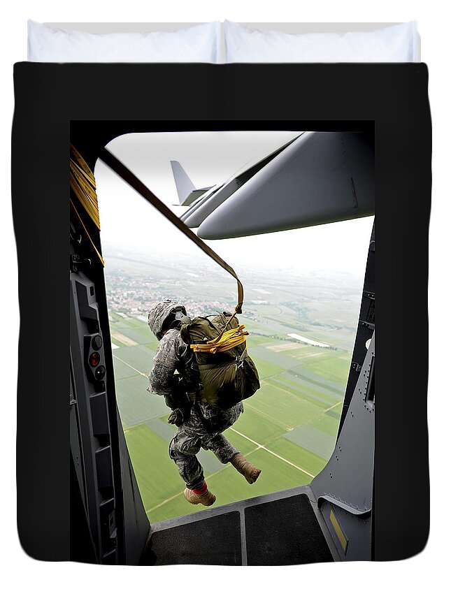 C-17 Globemaster Duvet Cover featuring the photograph A Paratrooper Executes An Airborne Jump by Stocktrek Images
