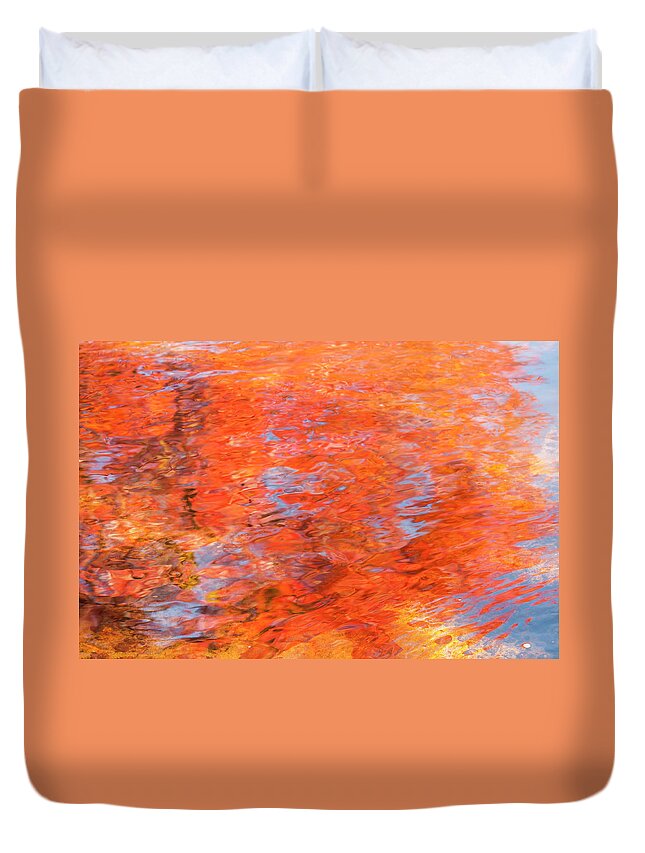 Autumn Duvet Cover featuring the photograph Colors reflecting in a pond becomes a wash of color. by Usha Peddamatham