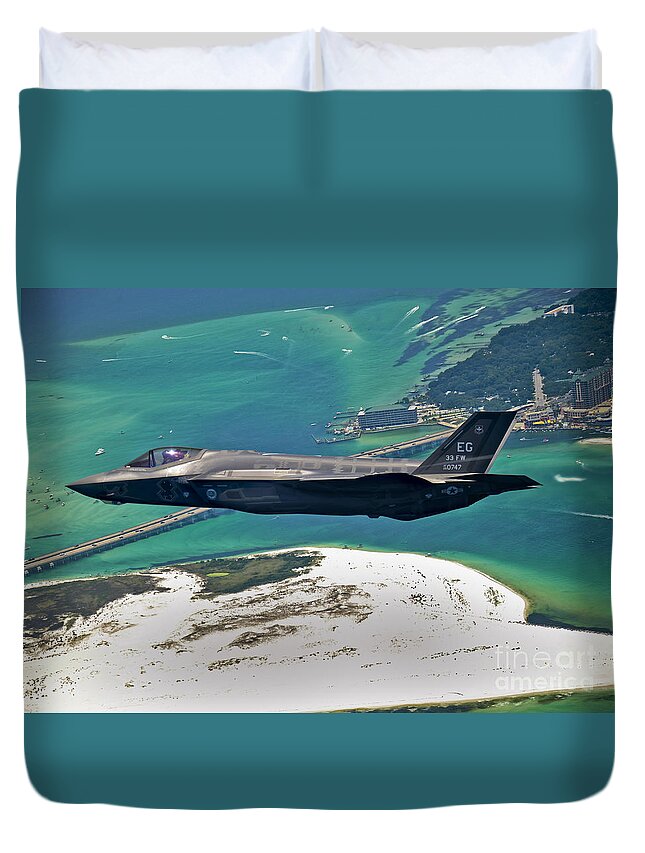 Stealth Duvet Cover featuring the photograph An F-35 Lightning II Flies Over Destin by Stocktrek Images