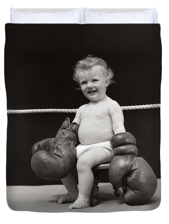 1930s Duvet Cover featuring the photograph Baby In Boxing Gloves, C. 1930s by H. Armstrong Roberts/ClassicStock