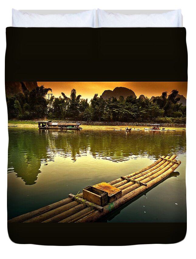 Sunset Duvet Cover featuring the photograph Bamboo raft preparing to cross the river-China Guilin scenery Lijiang River in Yangshuo by Artto Pan