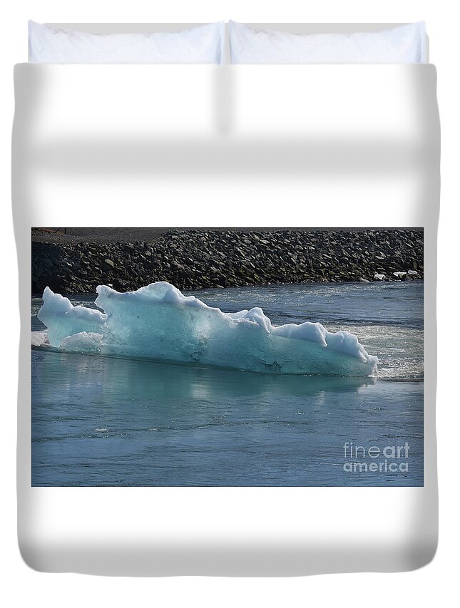Glacier Duvet Cover featuring the photograph Bluish tint in a icelandic iceburg in a lagoon by DejaVu Designs