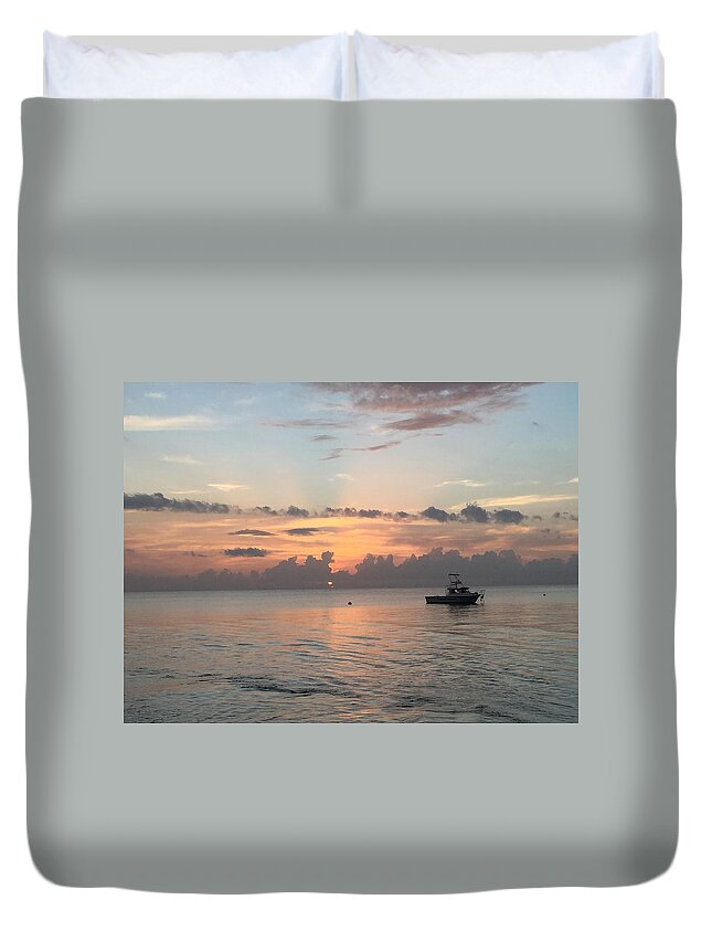  Duvet Cover featuring the photograph Boat in the sunset by Caitlyn Mccall