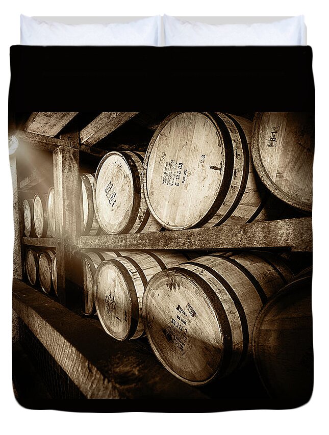 Bourbon Barrel Duvet Cover featuring the photograph Bourbon Barrels in Spotlight by Karen Varnas