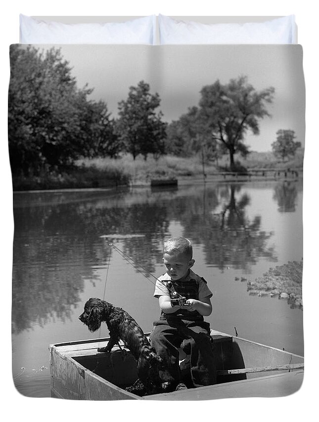 1940s Duvet Cover featuring the photograph Boy With Dog In Fishing Boat by CS Bauer and ClassicStock