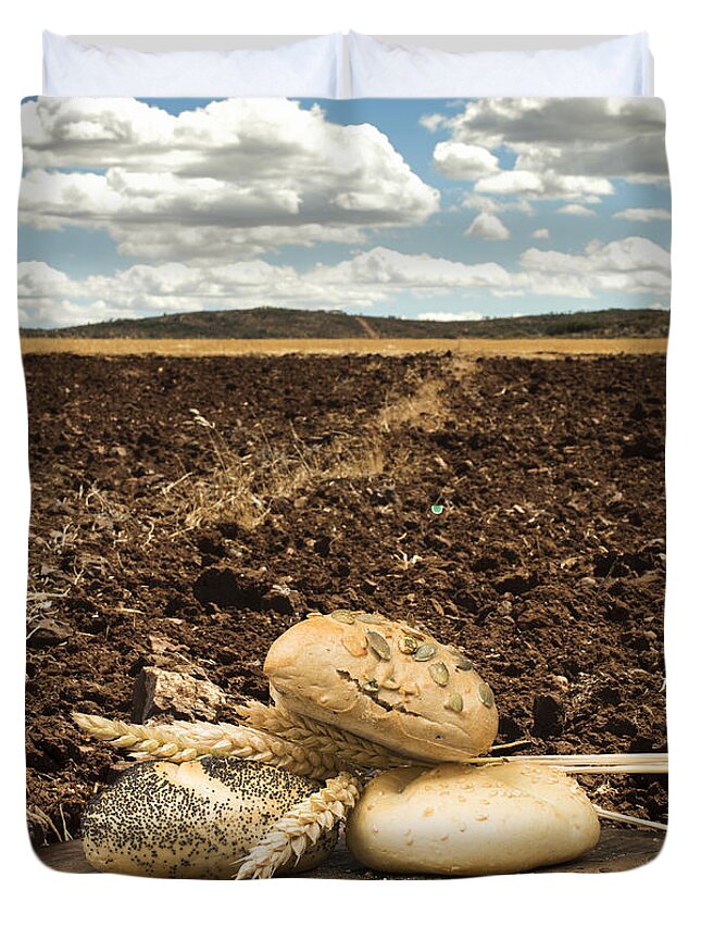 Plowed Land Duvet Cover featuring the photograph Bread and wheat ears. Plowed land by Deyan Georgiev