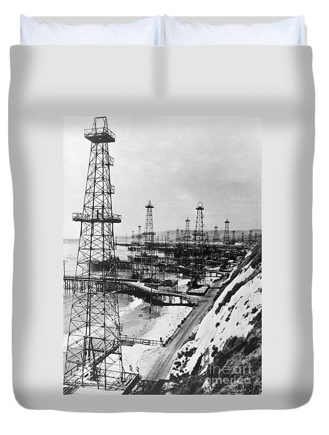 1944 Duvet Cover featuring the photograph CALIFORNIA - OIL WELL DERRICKS, c1944 by Granger