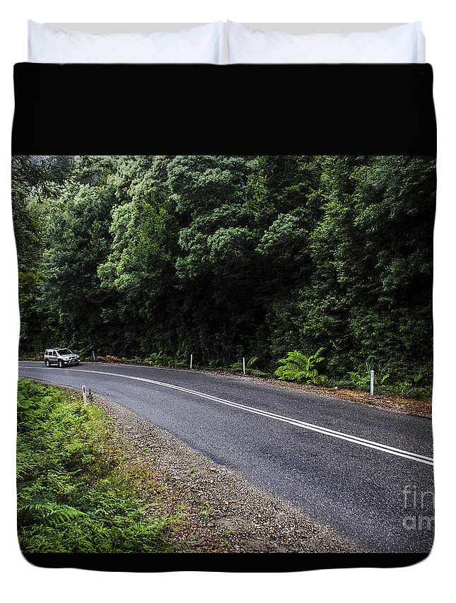 Car Duvet Cover featuring the photograph Car travelling through rainforest in West Tasmania by Jorgo Photography