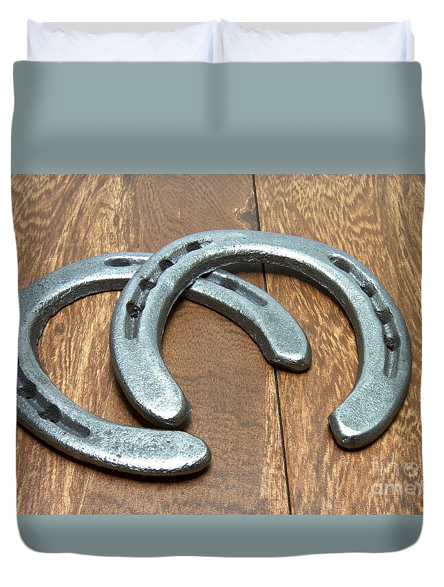 Cast Iron Duvet Cover featuring the photograph Cast Iron Horseshoes on Barn Wood by Karen Foley