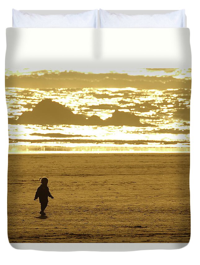 Sunset Duvet Cover featuring the photograph Child on the Beach by Coby Cooper