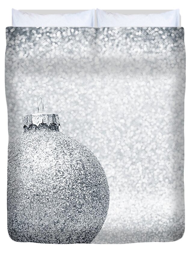 Christmas Duvet Cover featuring the photograph Christmas glass balls decoration on silver glitter background by Michal Bednarek