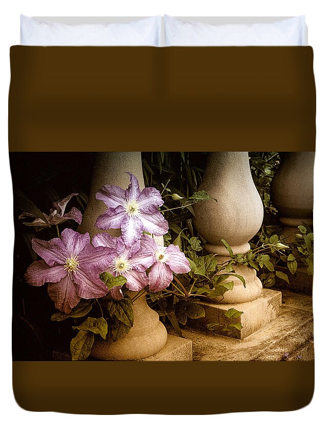 Clematis Duvet Cover featuring the photograph Clematis in the Garden by Julie Palencia