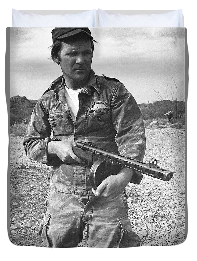 Close Up Of Barry Sadler Shooting Another Type Of His Numerous Machine Guns Tucson Arizona 1971. Duvet Cover featuring the photograph Close up of Barry Sadler shooting another type of his numerous machine guns Tucson Arizona 1971. by David Lee Guss