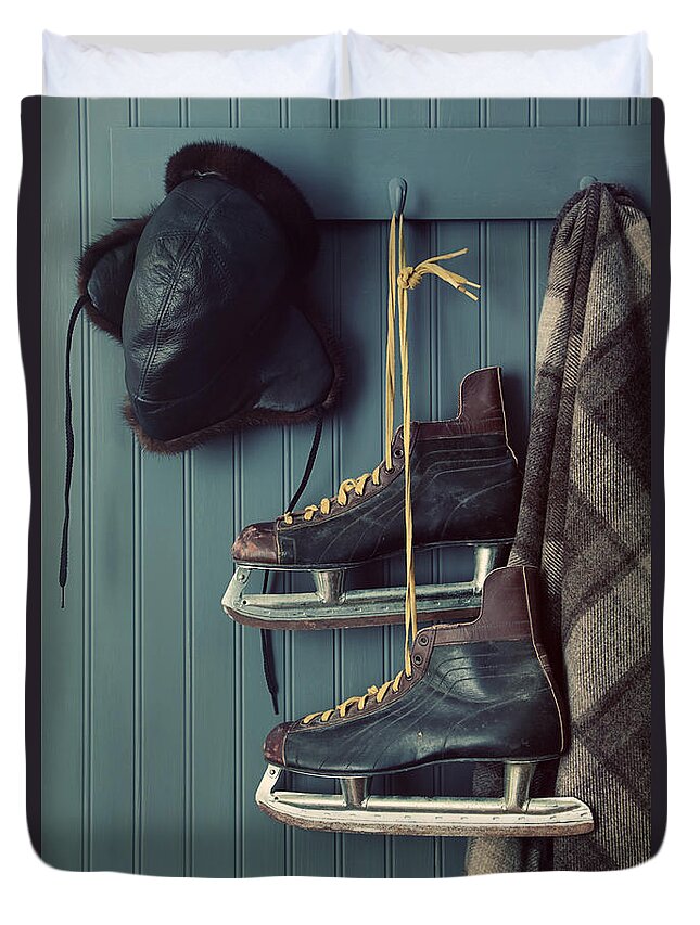 Aging Duvet Cover featuring the photograph Closeup of old skates on hooks by Sandra Cunningham