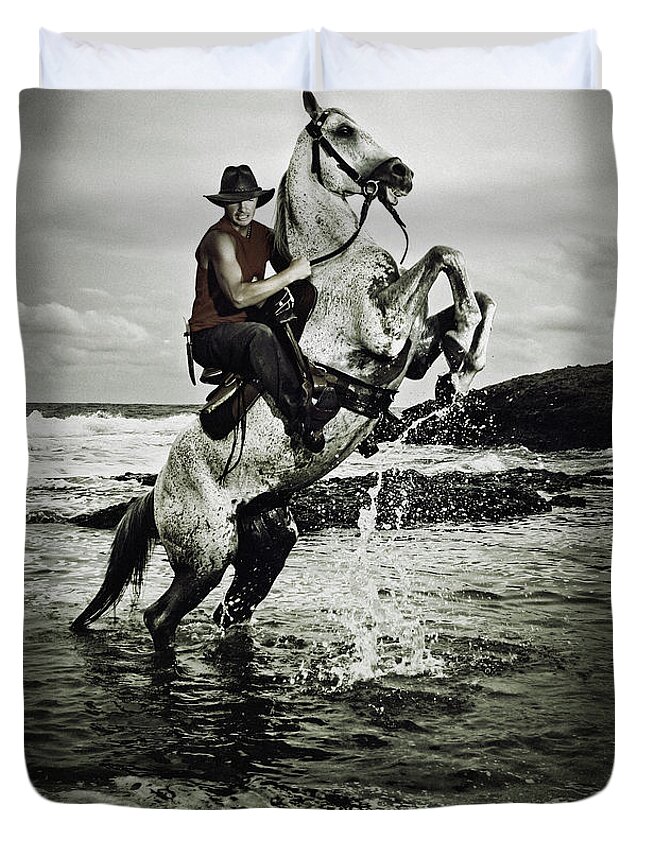 Horse Duvet Cover featuring the photograph Cowboy on the rear up horse in the river by Dimitar Hristov