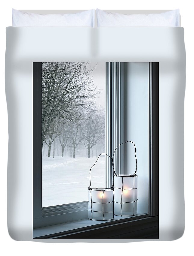 Lantern Duvet Cover featuring the photograph Cozy lanterns and winter landscape seen through the window by GoodMood Art
