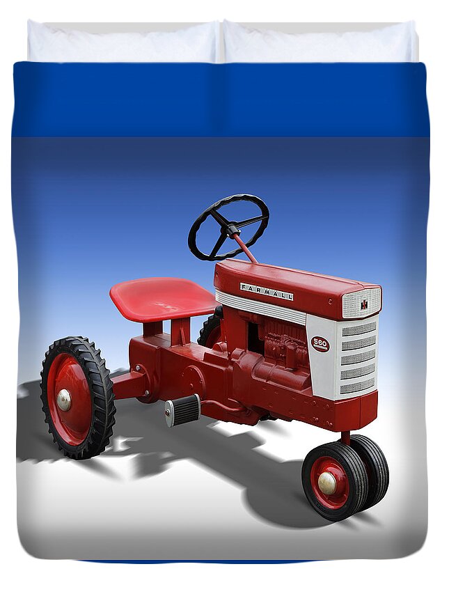 Farmall Duvet Cover featuring the photograph Farmall Peddle Tracter by Mike McGlothlen