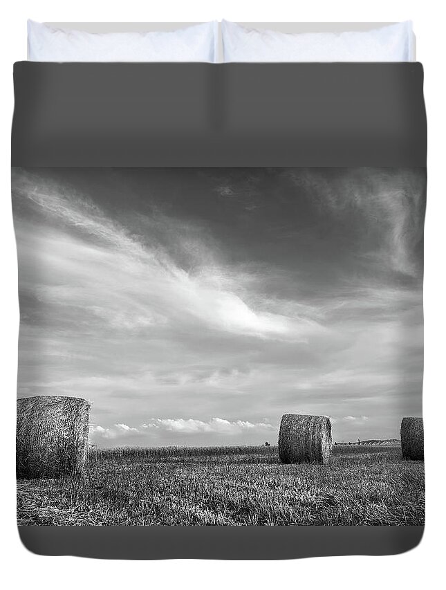 Agriculture Duvet Cover featuring the photograph Field of Round bales of hay after harvesting by Michalakis Ppalis