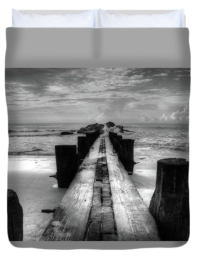 Folly Beach Pilings Duvet Cover featuring the photograph Folly Beach Pilings Charleston South Carolina In Black and White by Carol Montoya
