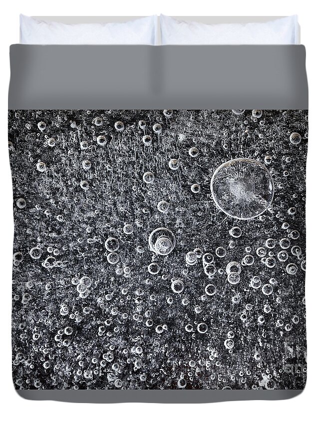Ice Duvet Cover featuring the photograph Frozen water background with black below by Simon Bratt