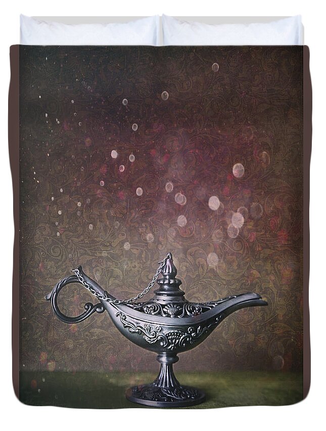  Magic Duvet Cover featuring the photograph Genie lamp on old book by Sandra Cunningham