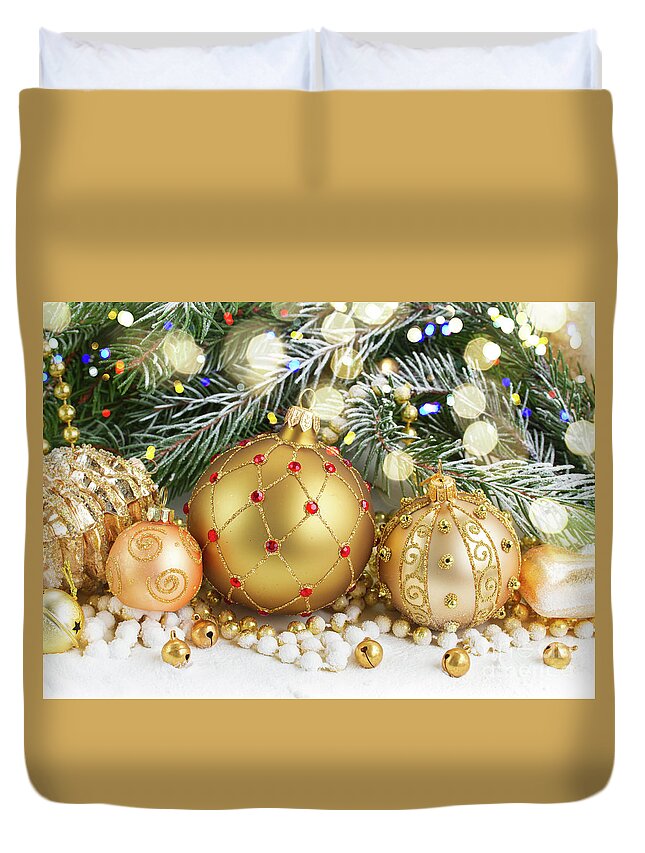 Christmas Duvet Cover featuring the photograph Golden Christmas Decorations in Snow by Anastasy Yarmolovich