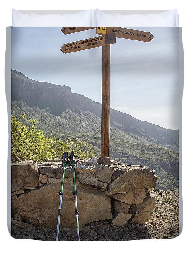 Active Duvet Cover featuring the photograph Hiking poles resting near sign by Patricia Hofmeester