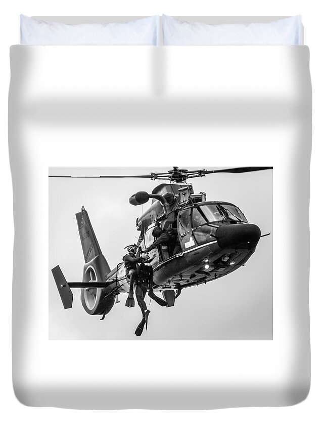 1 Pid Color Open Duvet Cover featuring the photograph Hoisting Victim into Helicopter by Gregory Daley MPSA