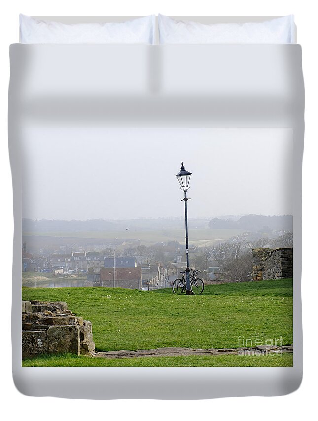 Lamppost Duvet Cover featuring the photograph Lamppost and bike. by Elena Perelman