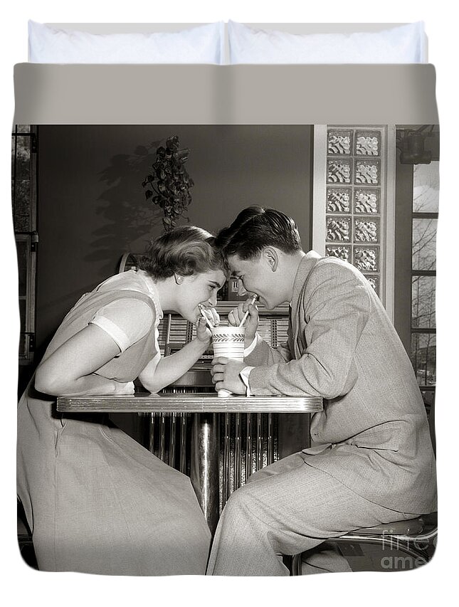 1950s Duvet Cover featuring the photograph Laughing Couple Sharing A Drink by H. Armstrong Roberts/ClassicStock