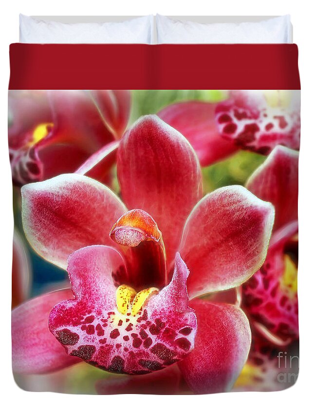 Orchid Duvet Cover featuring the photograph Laughing Orchids by Sue Melvin