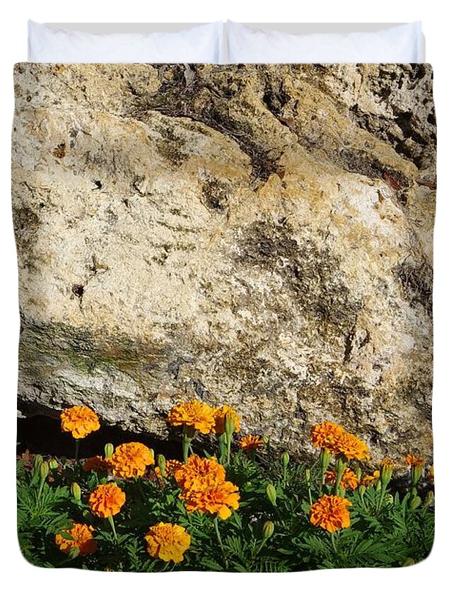 Limestone Duvet Cover featuring the photograph Limestone Boulder and Marigolds by Richard Rizzo