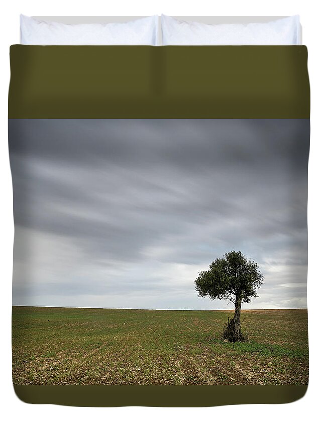 Olive Tree Duvet Cover featuring the photograph Lonely Olive tree with moving clouds by Michalakis Ppalis