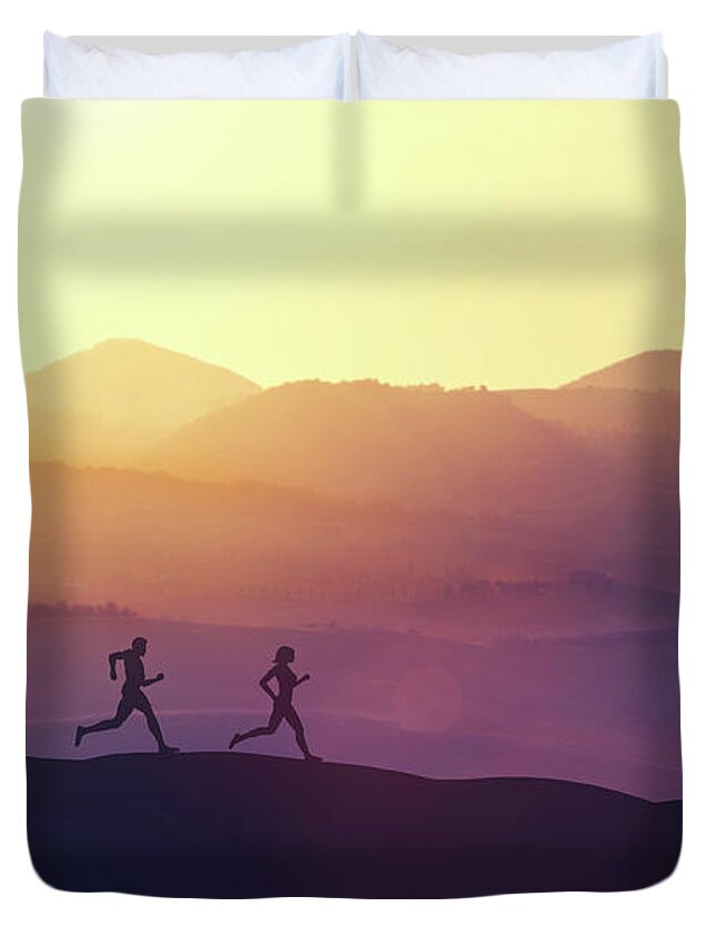 Man Duvet Cover featuring the photograph Man and woman running on a hill in the country by Michal Bednarek