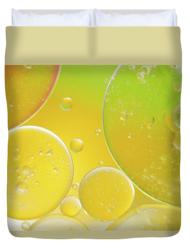 Water Duvet Cover featuring the photograph Oil and water bubbles by Andy Myatt