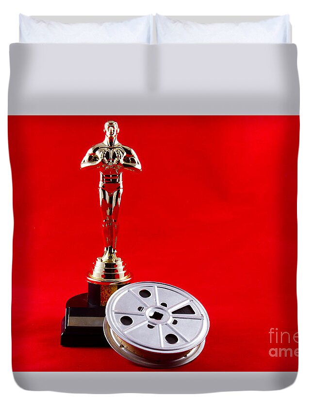 Academy Duvet Cover featuring the photograph Oscar Statuette with Movie Reel by Karen Foley
